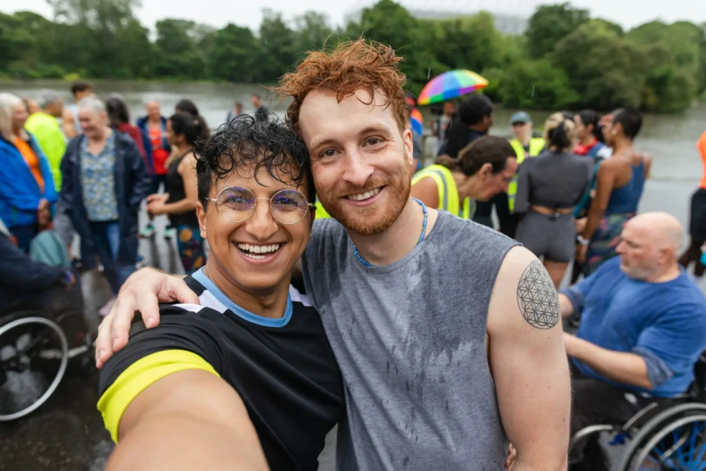 Two people enjoying a rainy day event