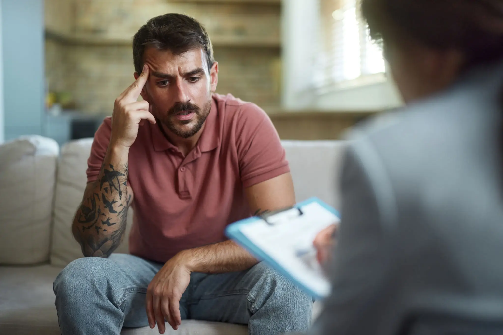 Man in therapy session looking distressed