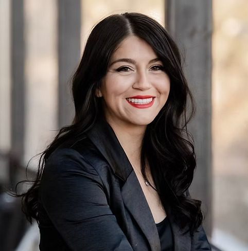 Smiling woman portrait with dark hair, red lipstick