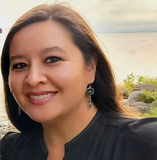 Smiling portrait of woman with dangling earrings