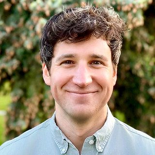 Smiling young man portrait outdoors