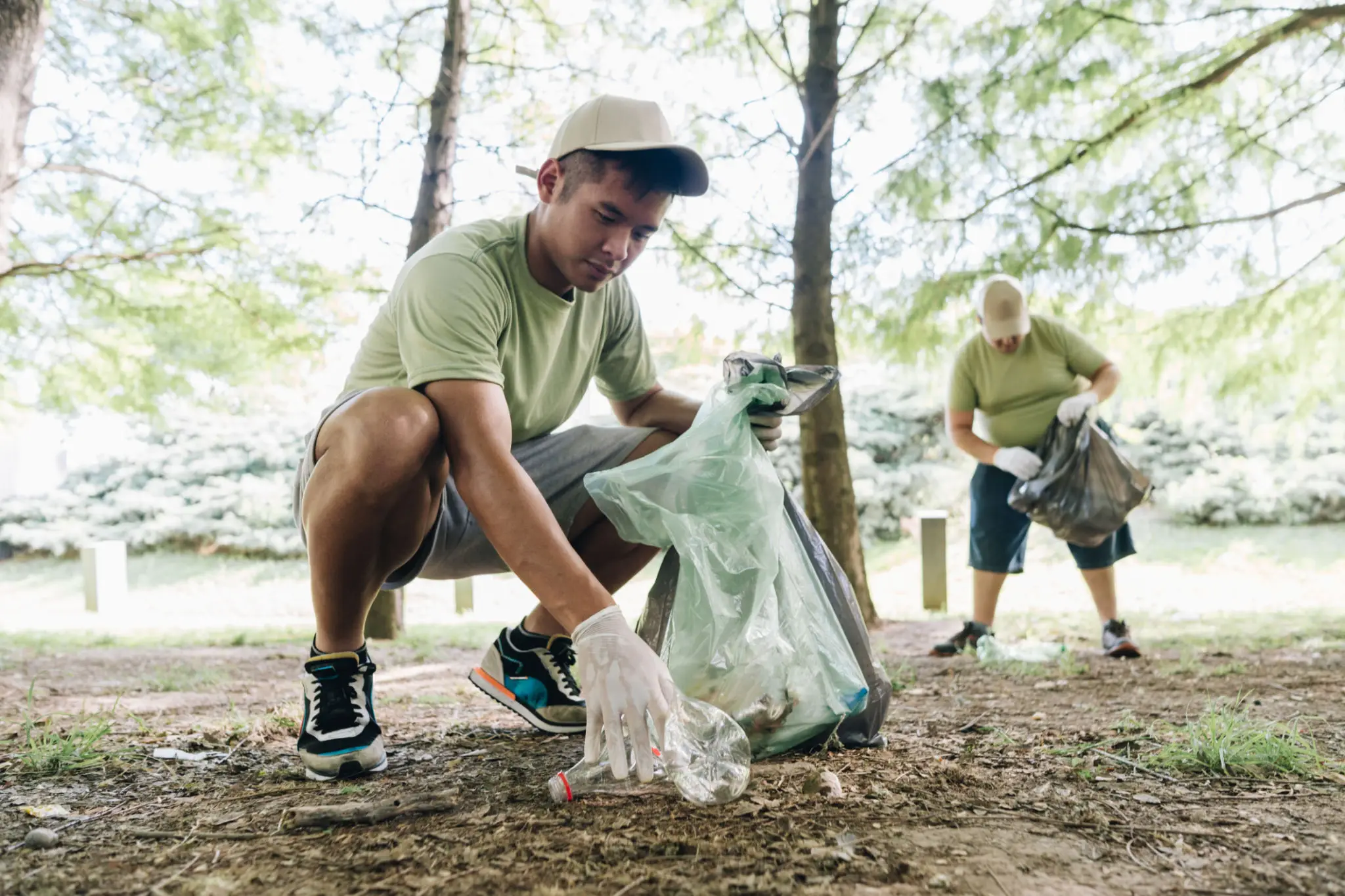 Volunteers picking up litter in park
