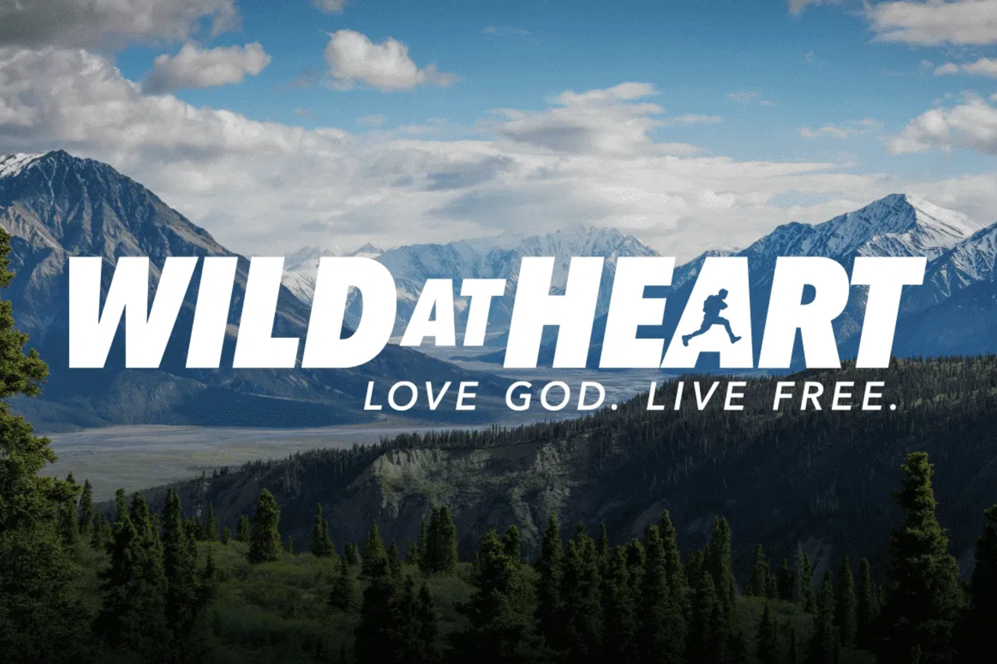 Wild at Heart logo over mountain landscape