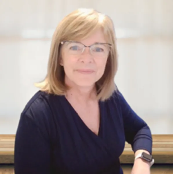 Smiling woman with glasses and smartwatch