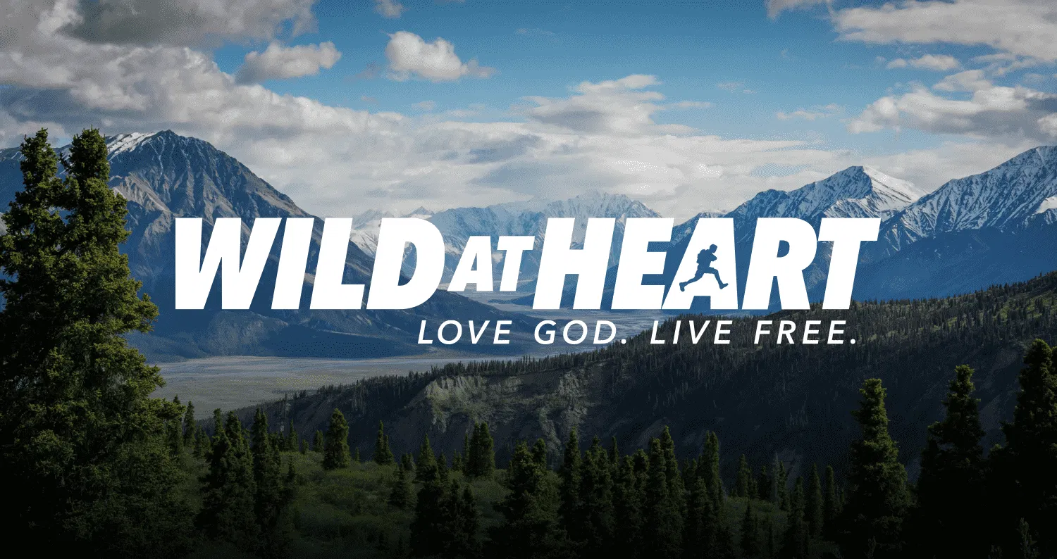 Mountain landscape with Wild at Heart text